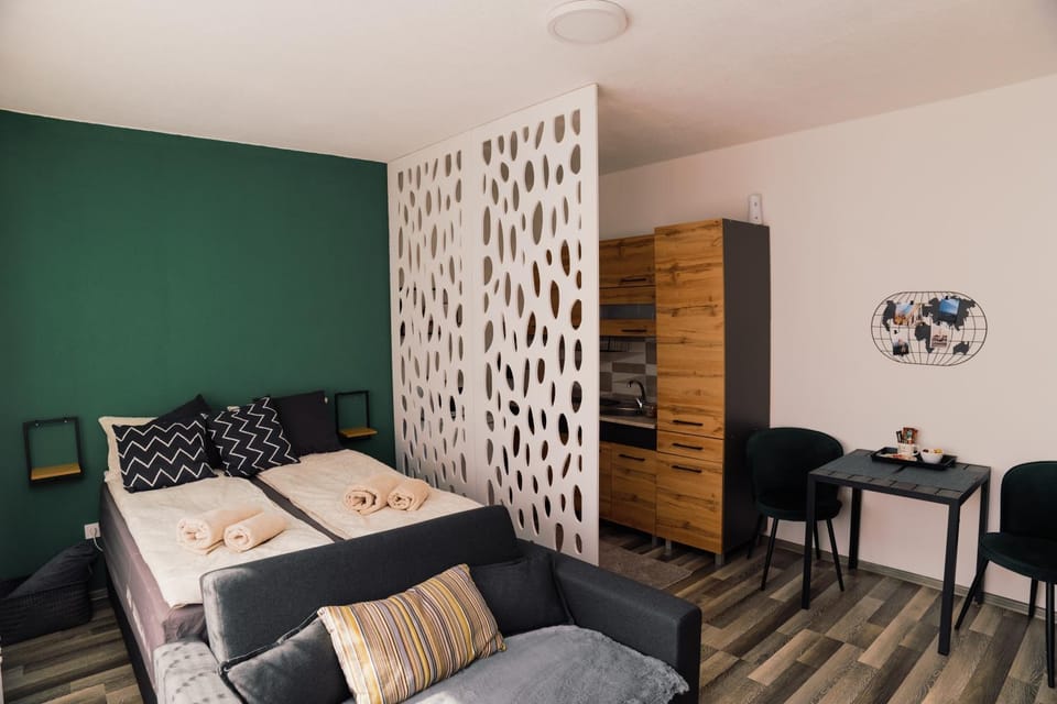 Bed, Seating area, towels, wardrobe