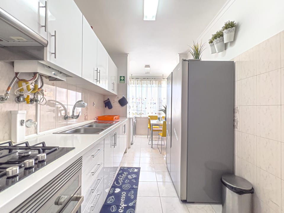 Kitchen or kitchenette, dishwasher, oven, stove