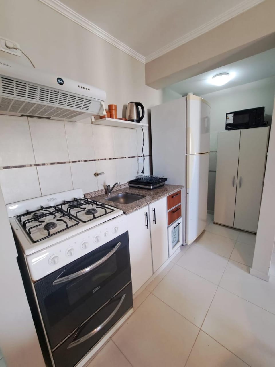 Kitchen or kitchenette, oven, stove
