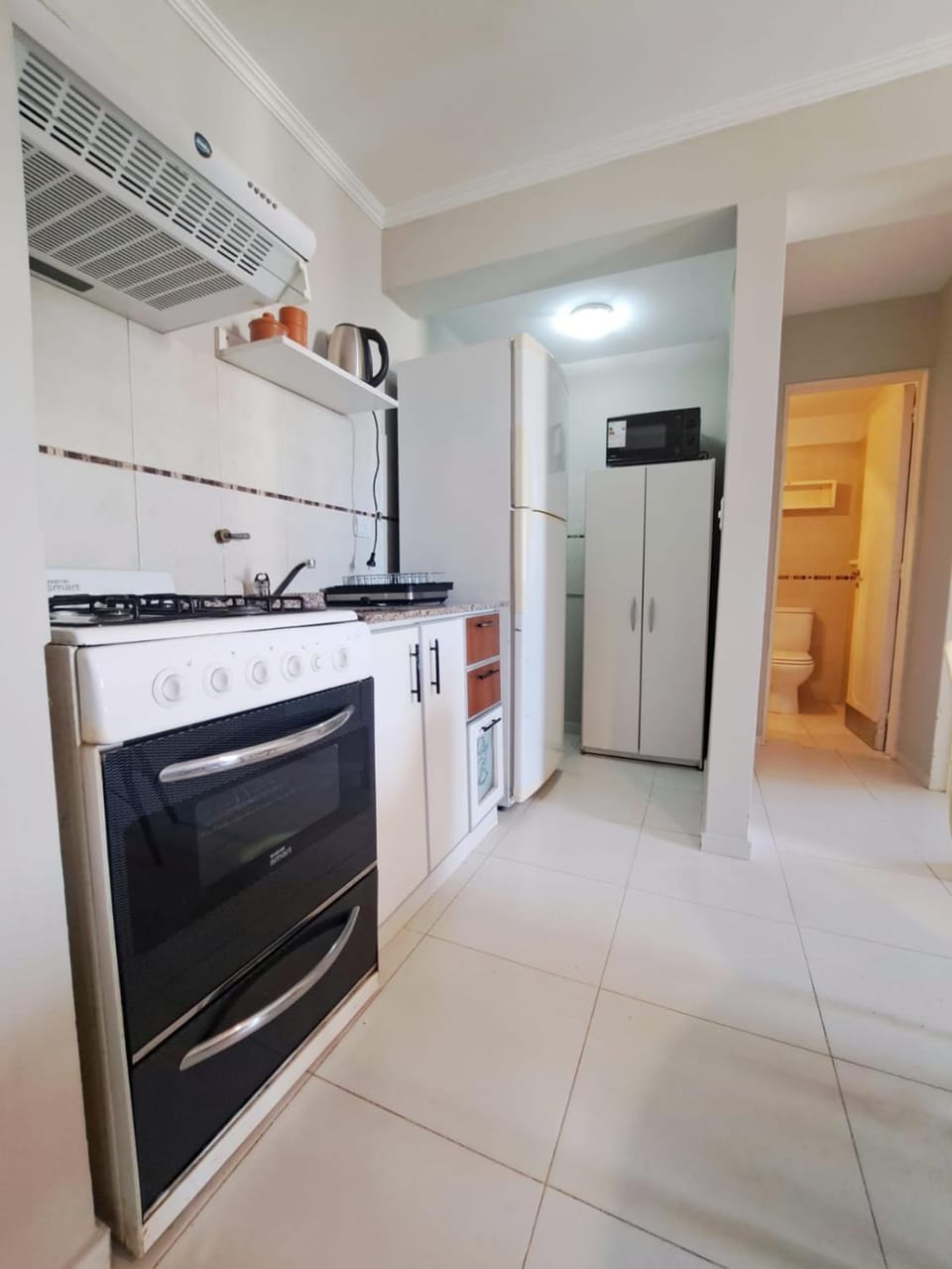 Kitchen or kitchenette, oven, stove