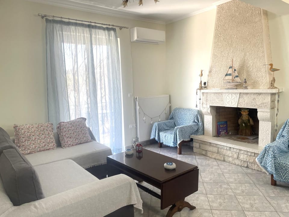 Living room, Seating area, fireplace, air conditioner