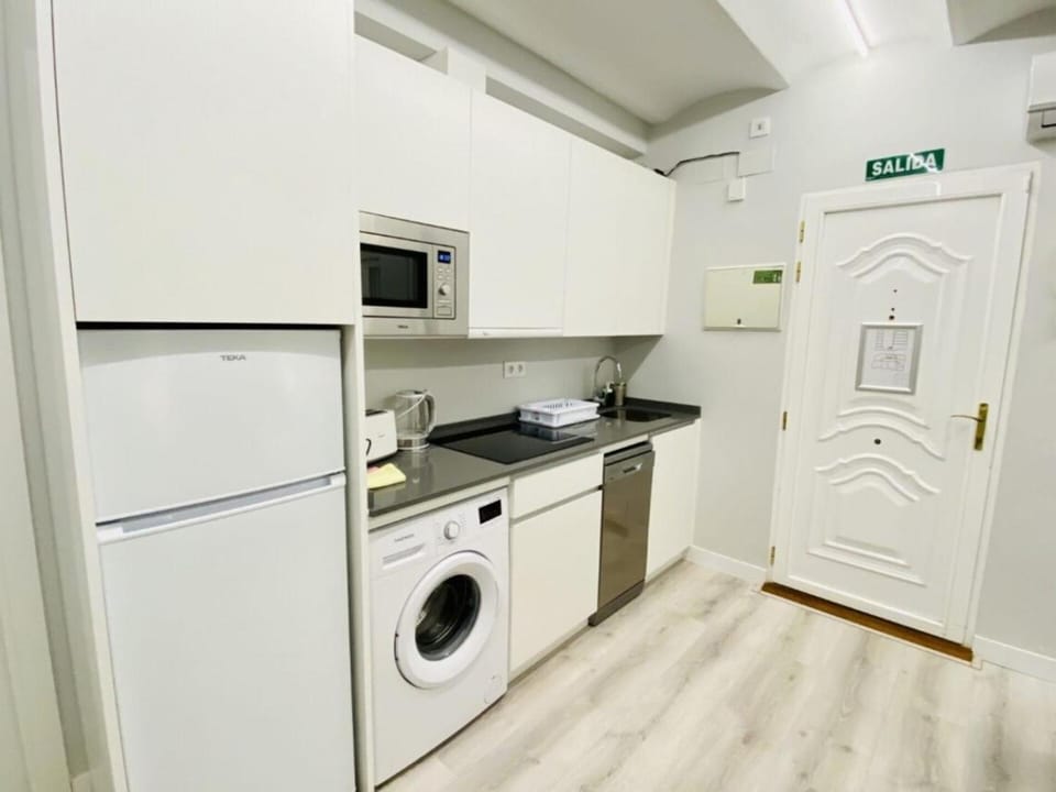 Kitchen or kitchenette, dishwasher, stove, washing machine