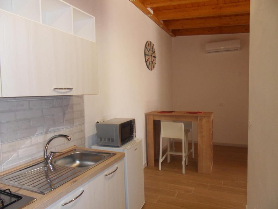 Kitchen or kitchenette, oven, stove, air conditioner