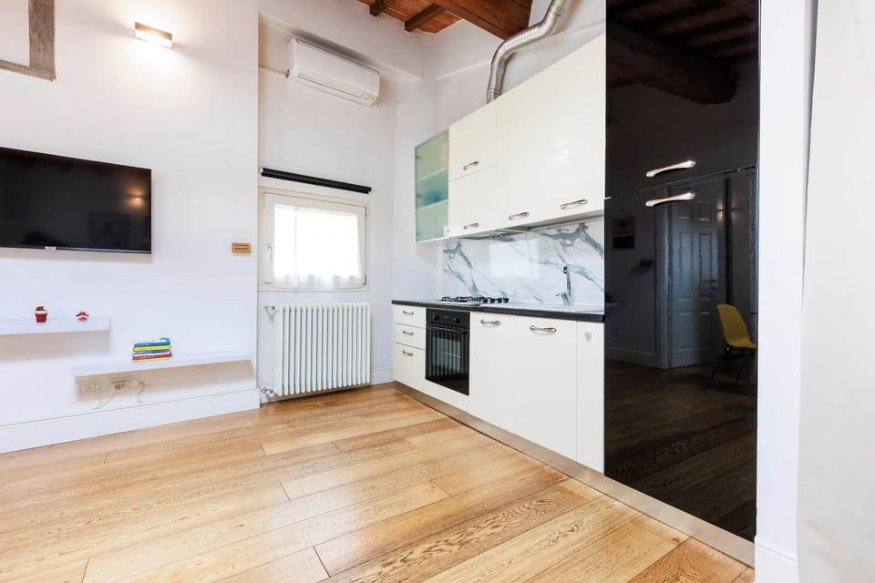 Kitchen or kitchenette, dishwasher, oven, stove