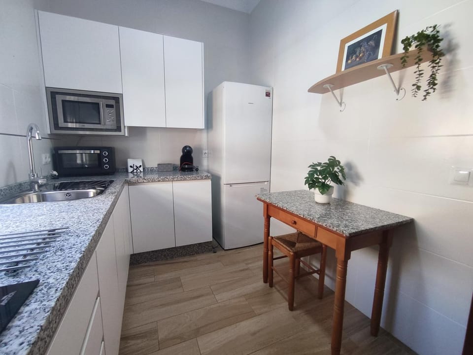 Kitchen or kitchenette, dishwasher, oven, stove, toaster