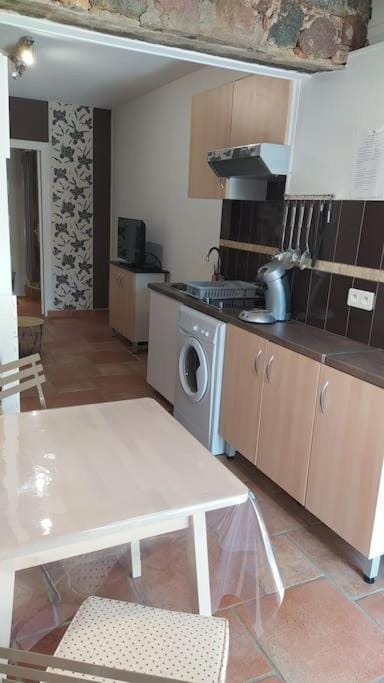 Kitchen or kitchenette, washing machine