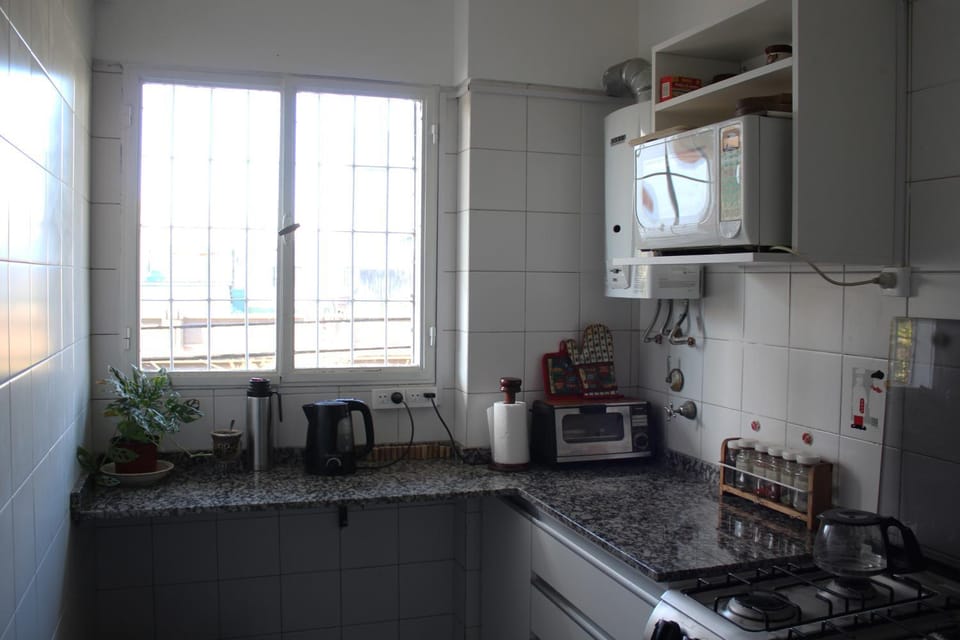 Kitchen or kitchenette, microwave, stove