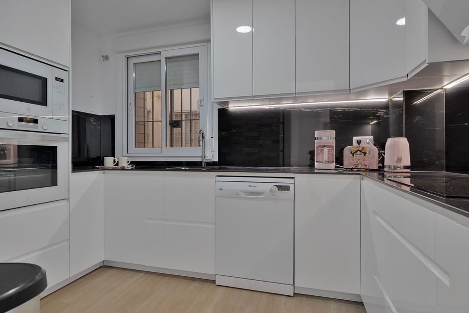 Kitchen or kitchenette, dishwasher, oven, stove, toaster