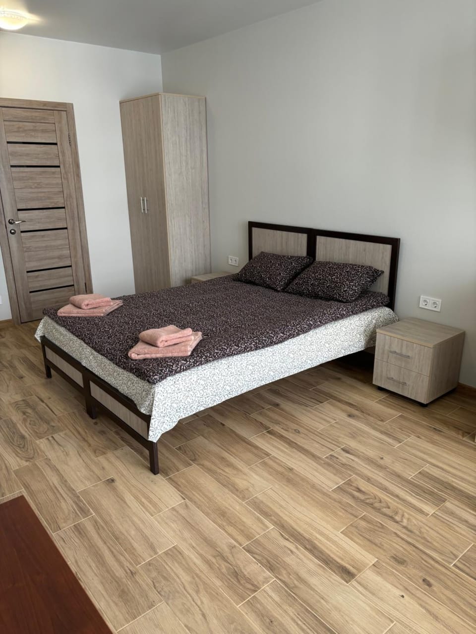 Bed, towels, wardrobe