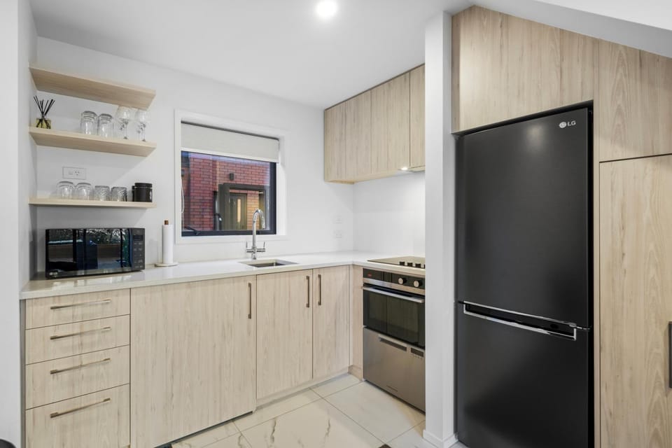 Kitchen or kitchenette, dishwasher, oven, stove