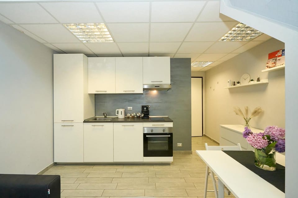 Kitchen or kitchenette, dishwasher, oven, stove