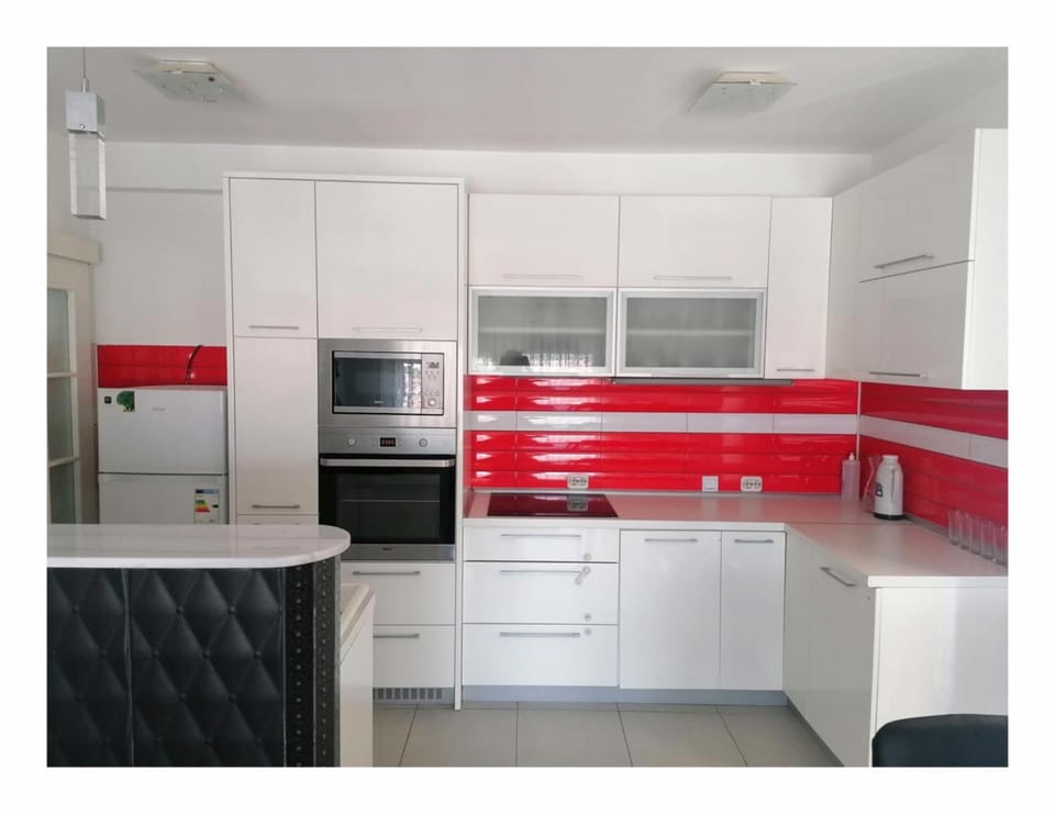Kitchen or kitchenette, dishwasher, oven, stove