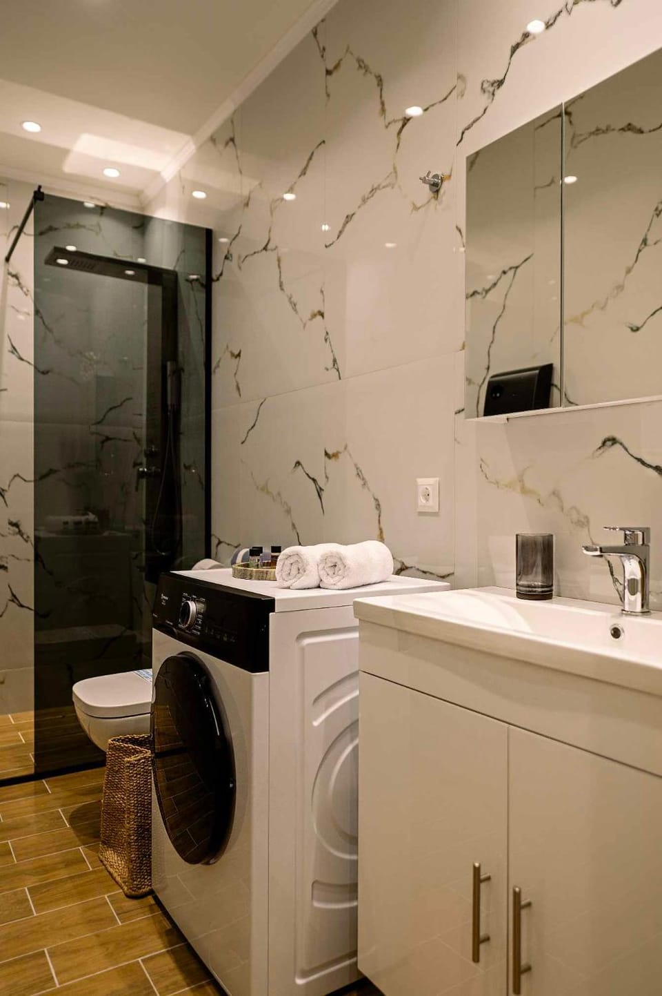 Toilet, towels, washing machine