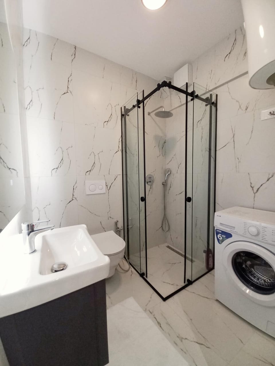 Shower, Toilet, Bathroom, towels, washing machine, dryer