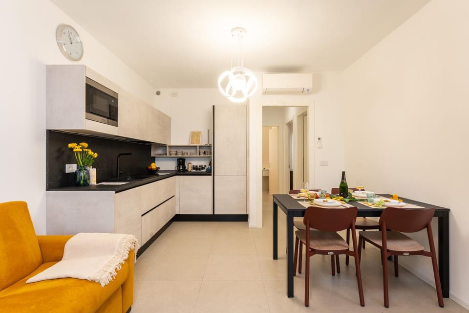 Kitchen or kitchenette, Dining area, dishwasher, microwave, stove, air conditioner