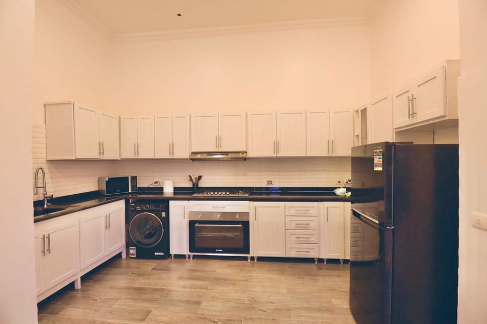 Kitchen or kitchenette, dishwasher, oven, stove