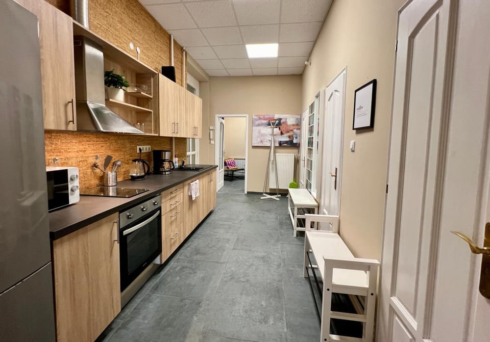 Kitchen or kitchenette, dishwasher, microwave, oven, stove