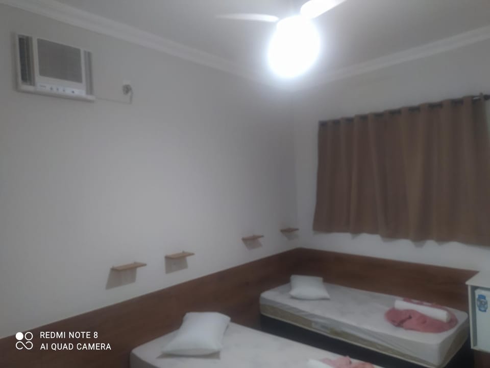 Pousada Quarto Deluxe perto da basílica com garagem Apartment hotel in State of São Paulo