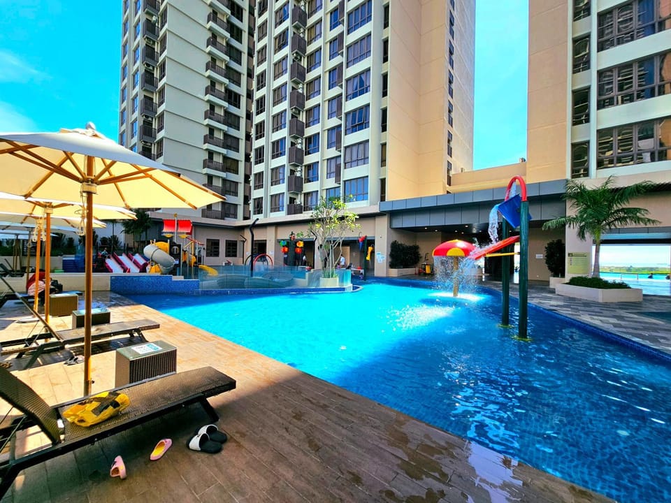 Property building, Day, Aqua park, Pool view, Swimming pool, sunbed