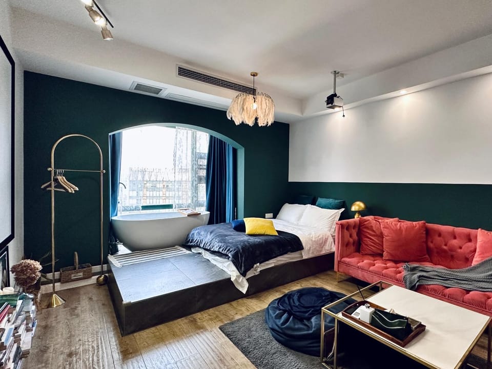 Bed, Living room, Seating area, Bedroom
