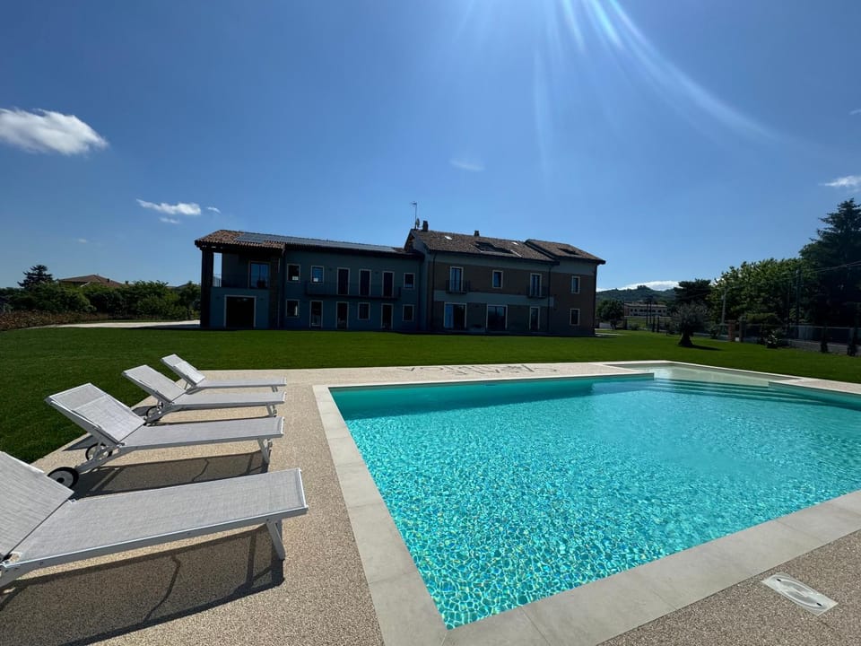 Property building, Day, View (from property/room), Pool view, Swimming pool, sunbed