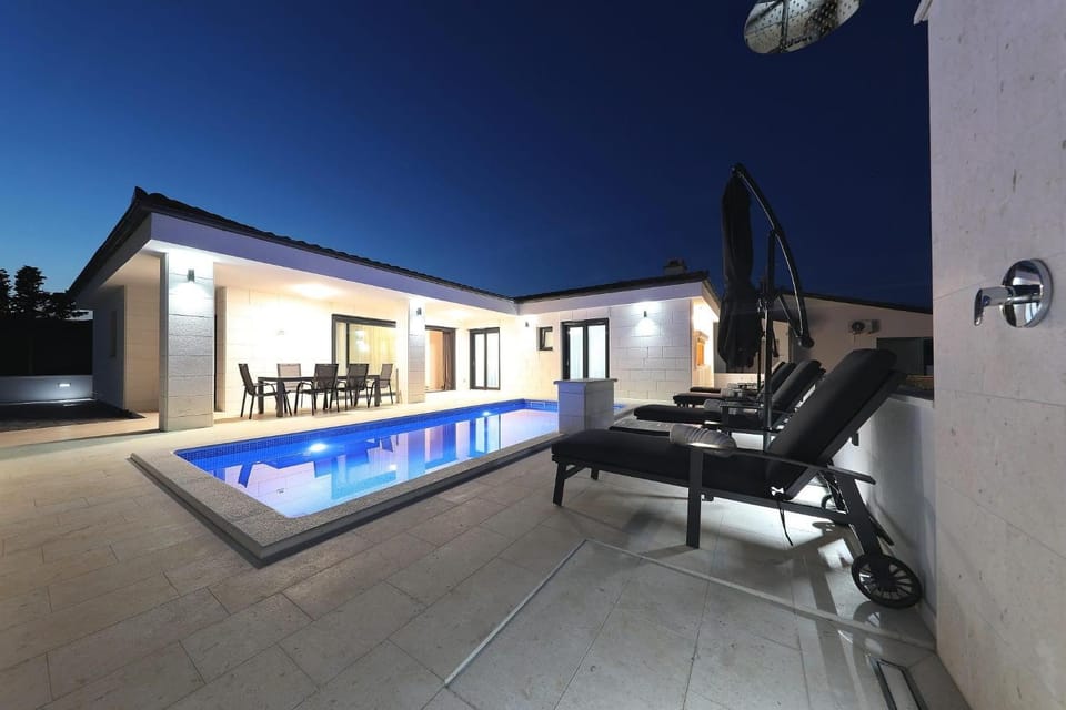 Patio, Night, Pool view, Swimming pool, sunbed