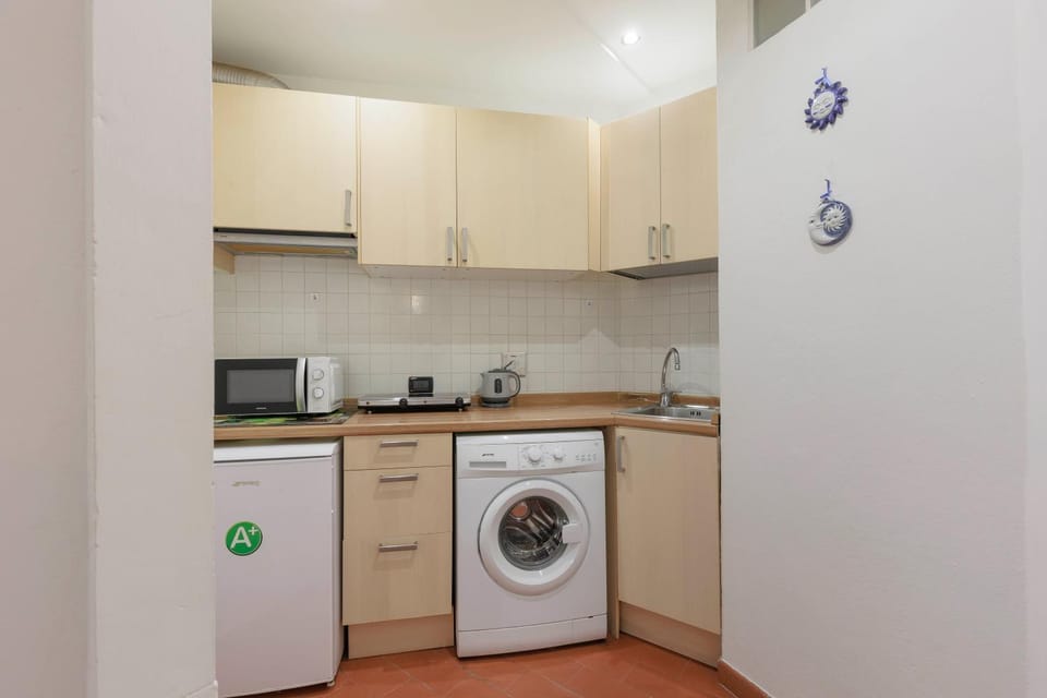 Kitchen or kitchenette, washing machine