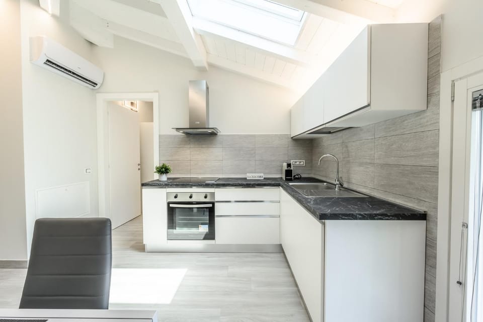 Kitchen or kitchenette, oven, stove, air conditioner