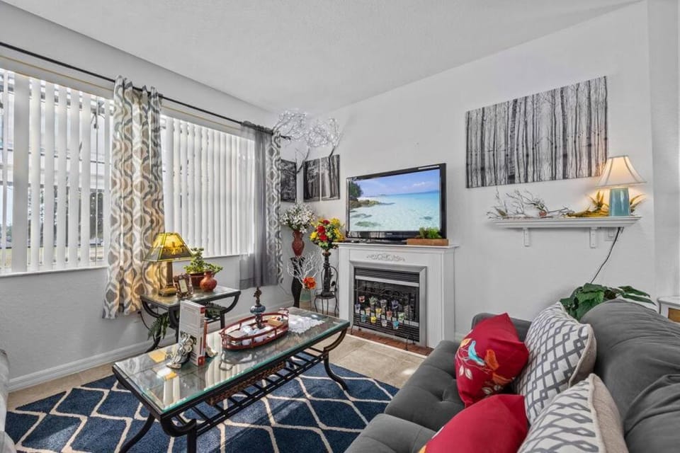 Communal lounge/ TV room, TV and multimedia, Living room, Decorative detail, Seating area, Evening entertainment, Pool view, fireplace, air conditioner