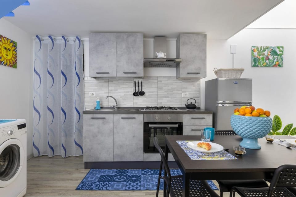 Kitchen or kitchenette, Dining area, oven, stove, toaster, washing machine