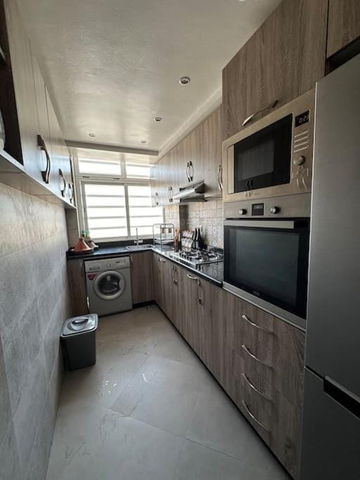 Kitchen or kitchenette, oven, stove, toaster, washing machine
