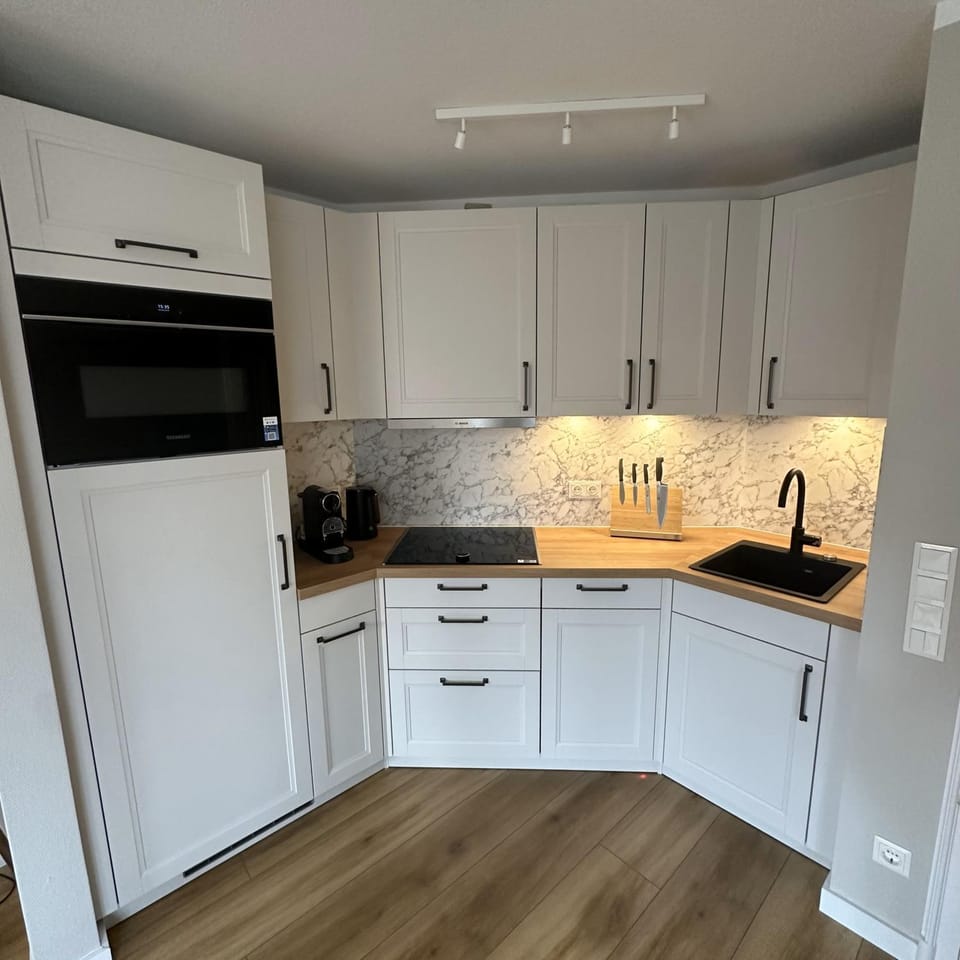 Kitchen or kitchenette, dishwasher, stove, toaster