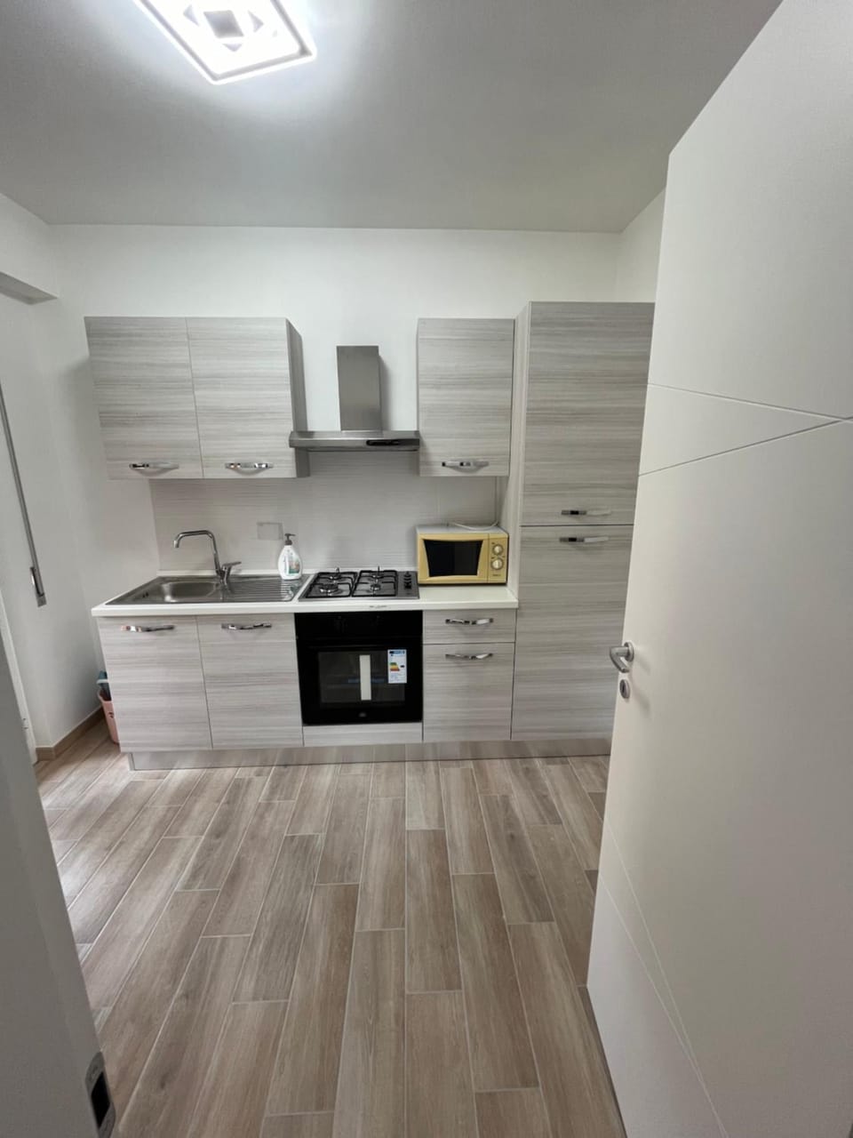 Kitchen or kitchenette, oven, stove
