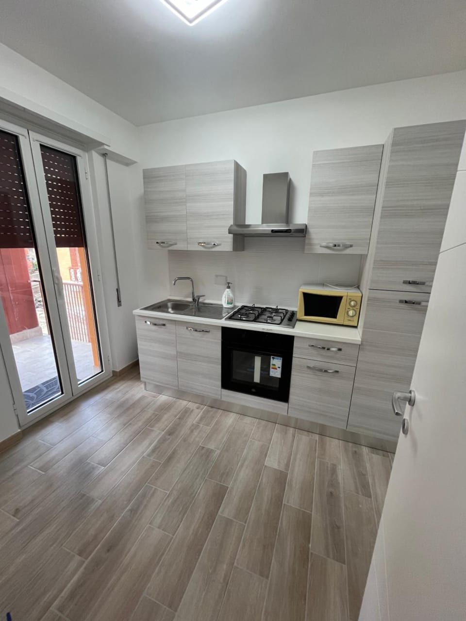 Kitchen or kitchenette, oven, stove
