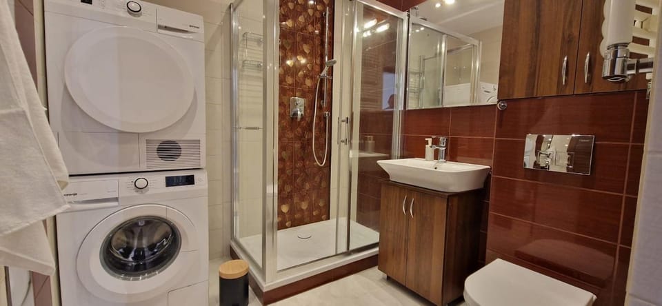 Shower, Toilet, Bathroom, towels, washing machine, dryer