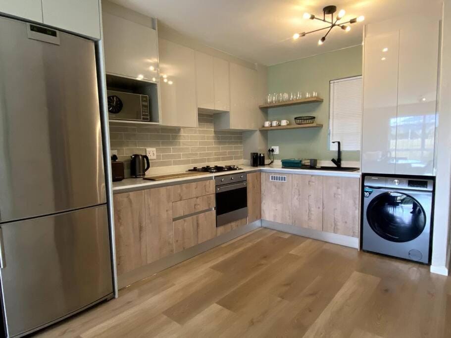 Kitchen or kitchenette, oven, stove, toaster, washing machine, dryer
