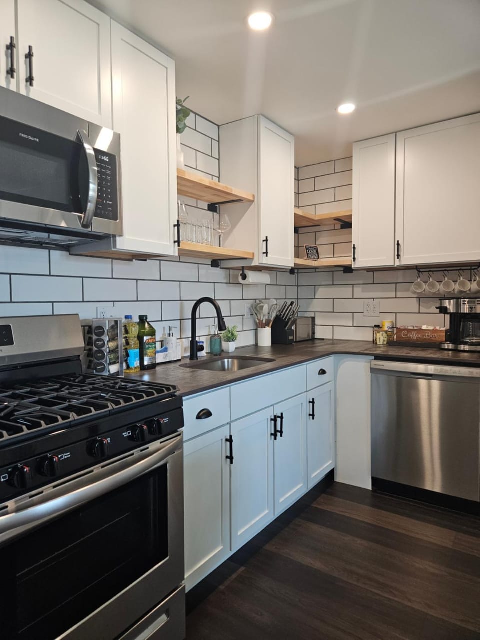 Kitchen or kitchenette, dishwasher, microwave, oven, stove, toaster