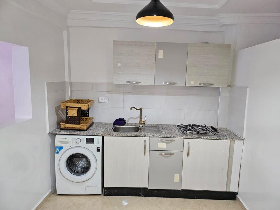Kitchen or kitchenette, stove, washing machine