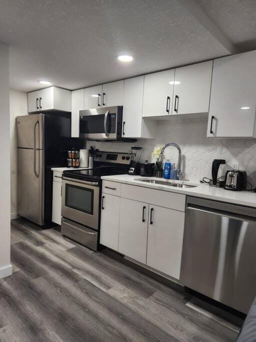 Kitchen or kitchenette, dishwasher, oven, stove, toaster