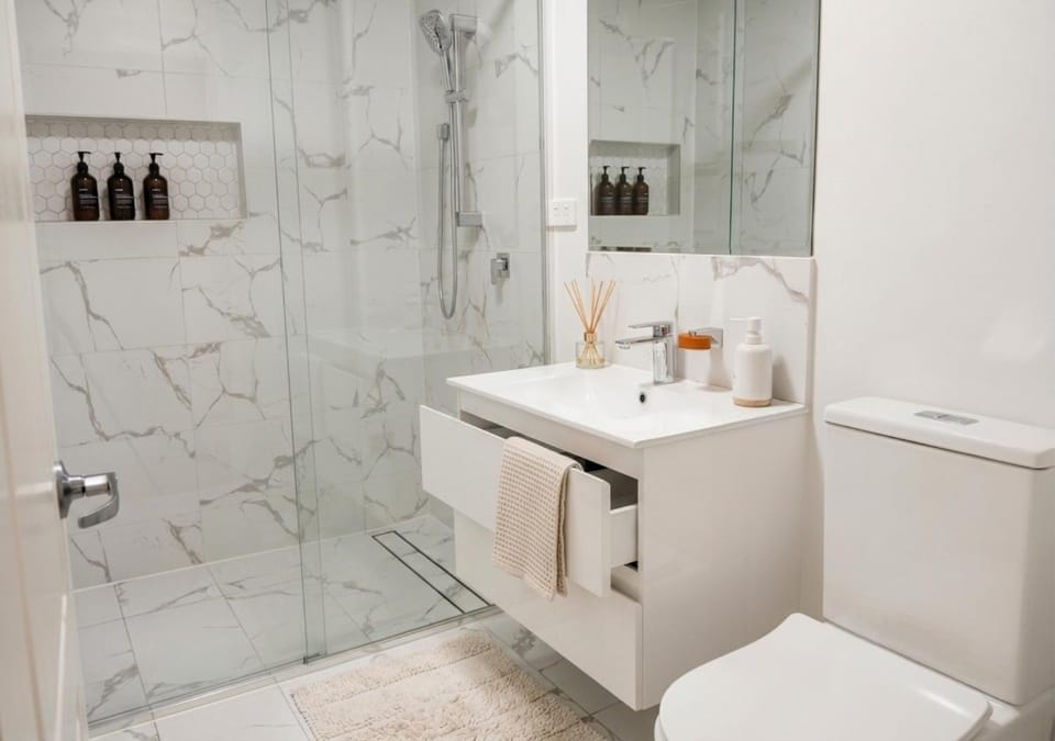 Shower, Toilet, Bathroom, hair dryier, towels