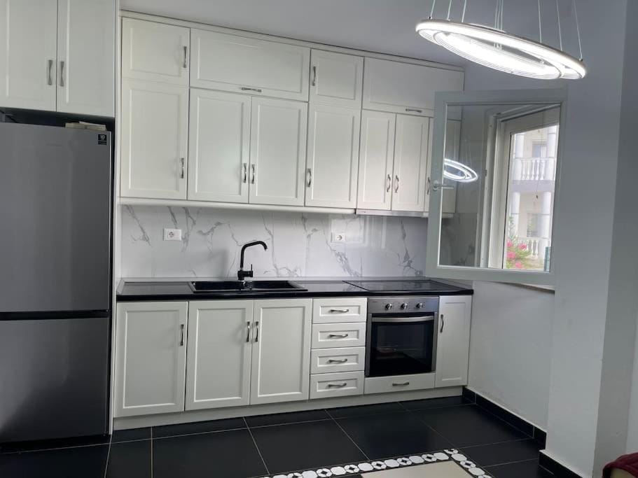 Kitchen or kitchenette, oven, stove