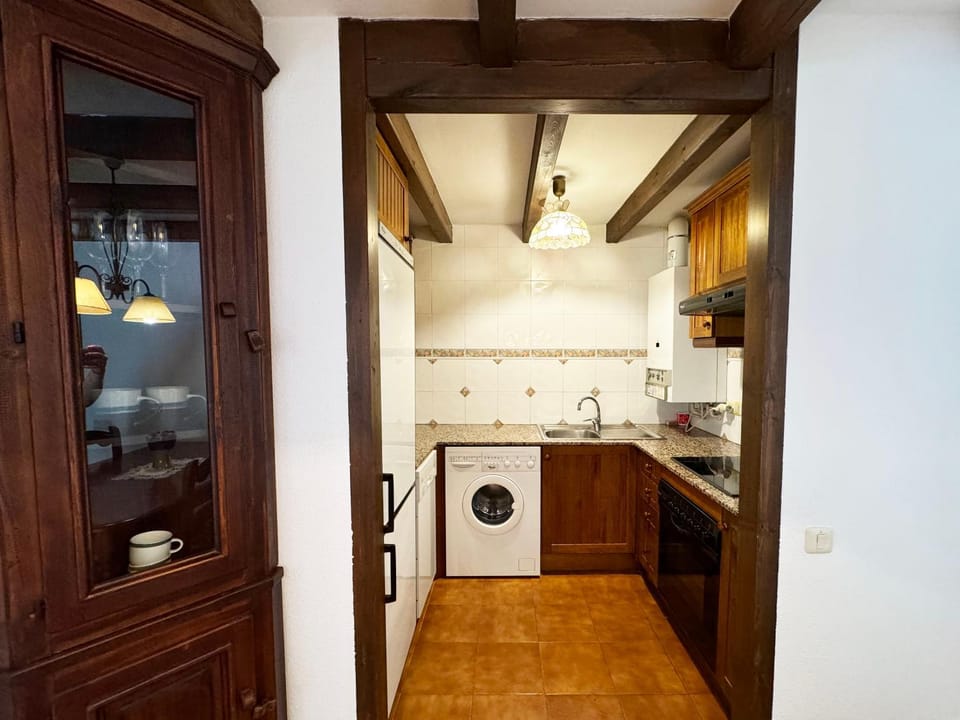 Kitchen or kitchenette, dishwasher, oven, stove, washing machine