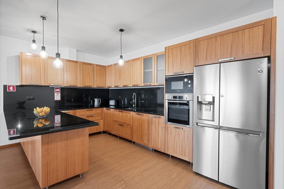 Kitchen or kitchenette, dishwasher, oven, stove
