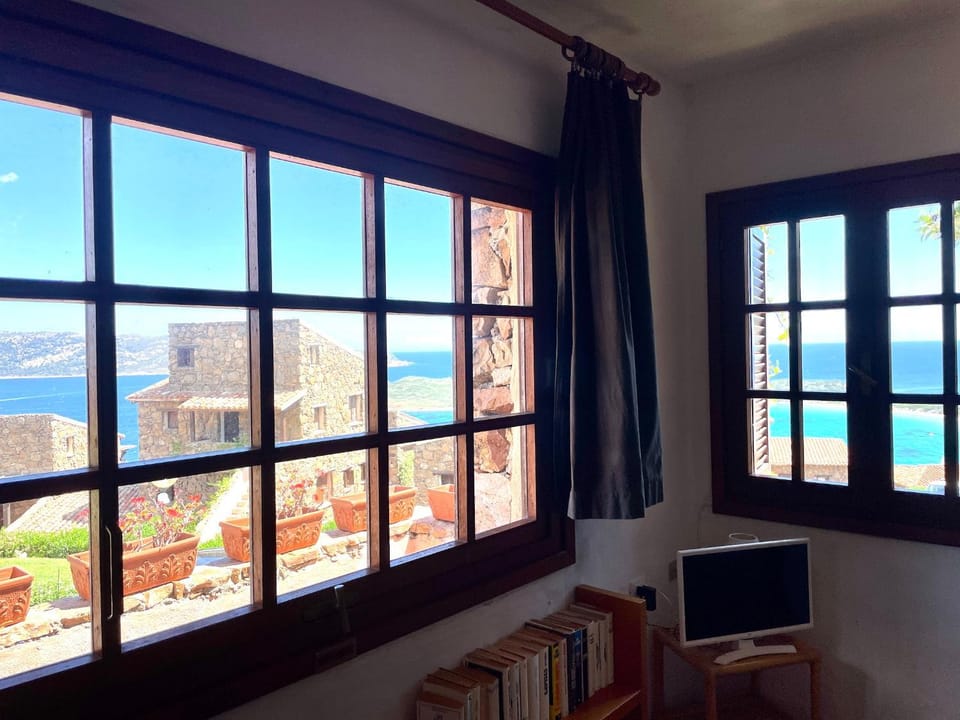 Natural landscape, View (from property/room), Living room, Seating area, Sea view