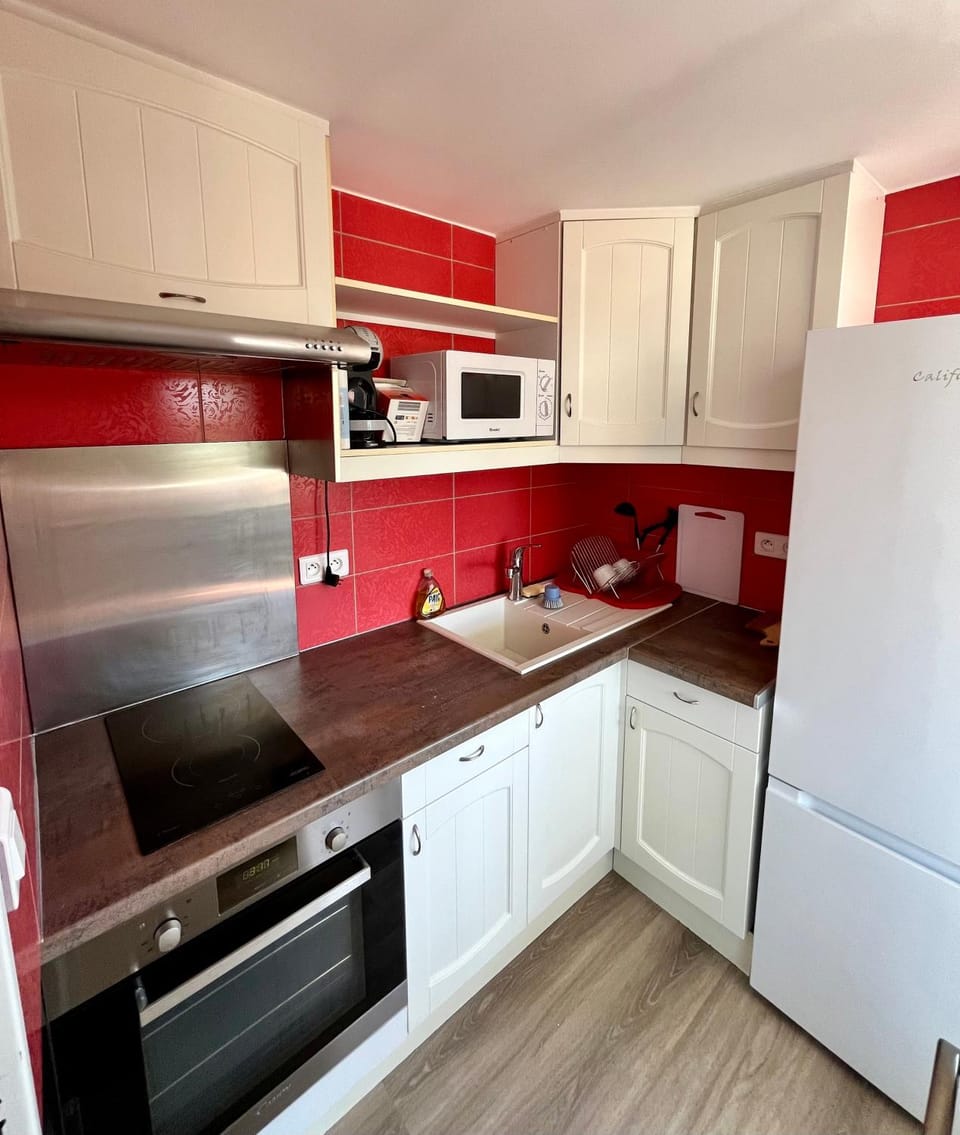 Kitchen or kitchenette, oven, stove, toaster, kitchen