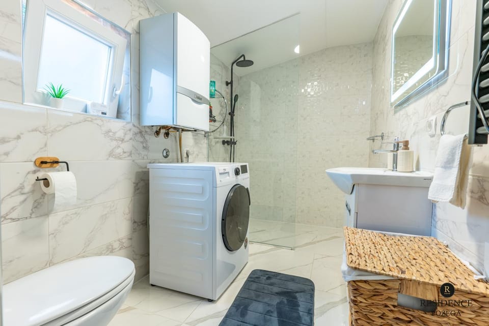 Shower, Toilet, Bathroom, towels, washing machine, dryer