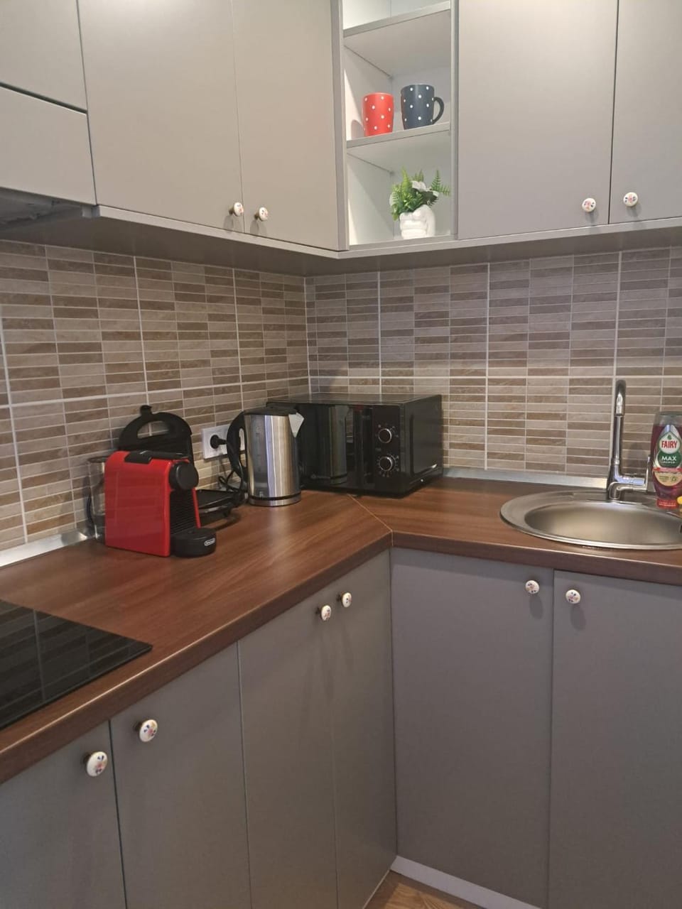 Kitchen or kitchenette, stove, toaster