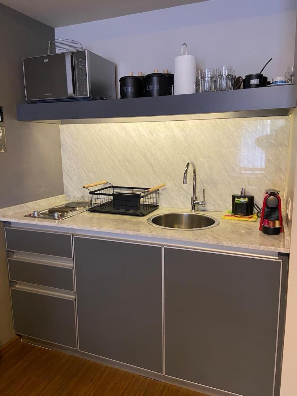 Kitchen or kitchenette, microwave, stove, toaster