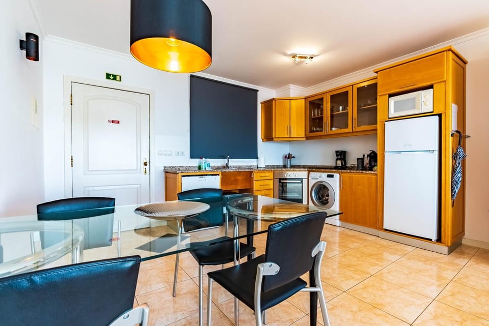 Kitchen or kitchenette, Dining area, dishwasher, oven, stove, washing machine