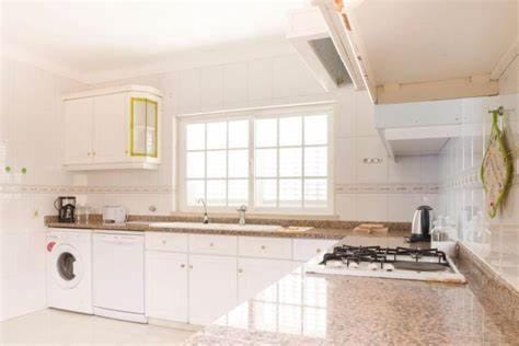 Kitchen or kitchenette, dishwasher, stove, toaster, washing machine